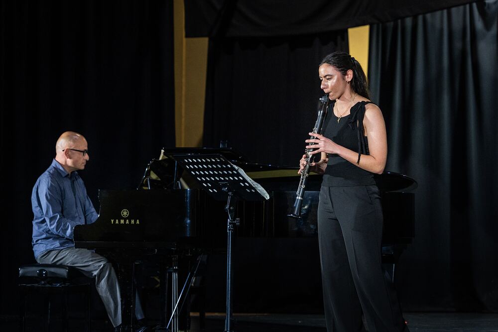 A clarinettist performs with a piano accompanist.